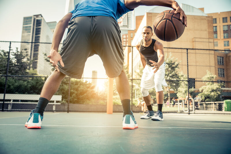 Basketball player playing outdoors